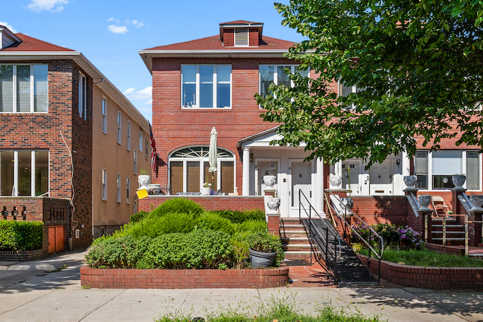 Original exterior photograph of the two-family home near Ocean Parkway and Quentin Road supplied in the marketing email